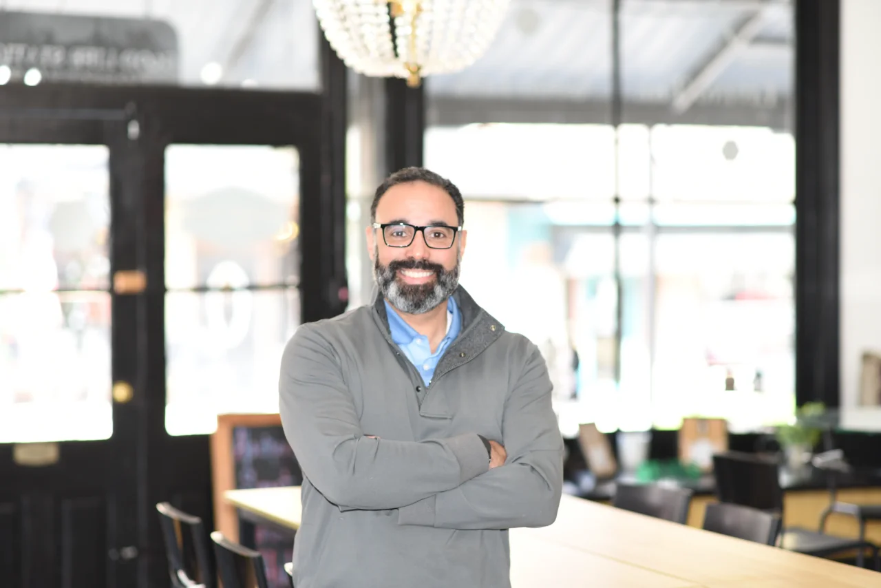 Confident Business Owner Standing In Cafe 1