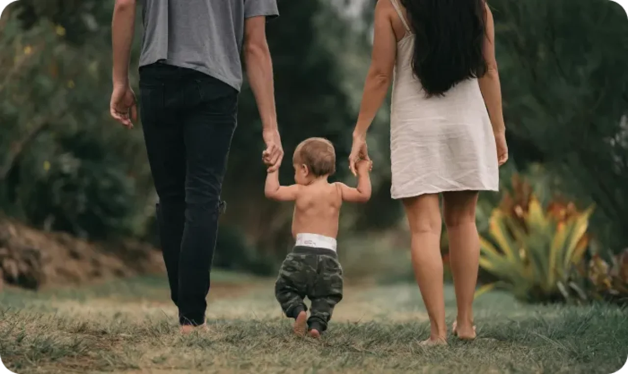 Couple Walking Barefoot With Child